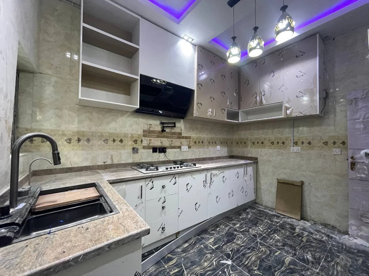 Fully fitted kitchen with sensor faucet sink