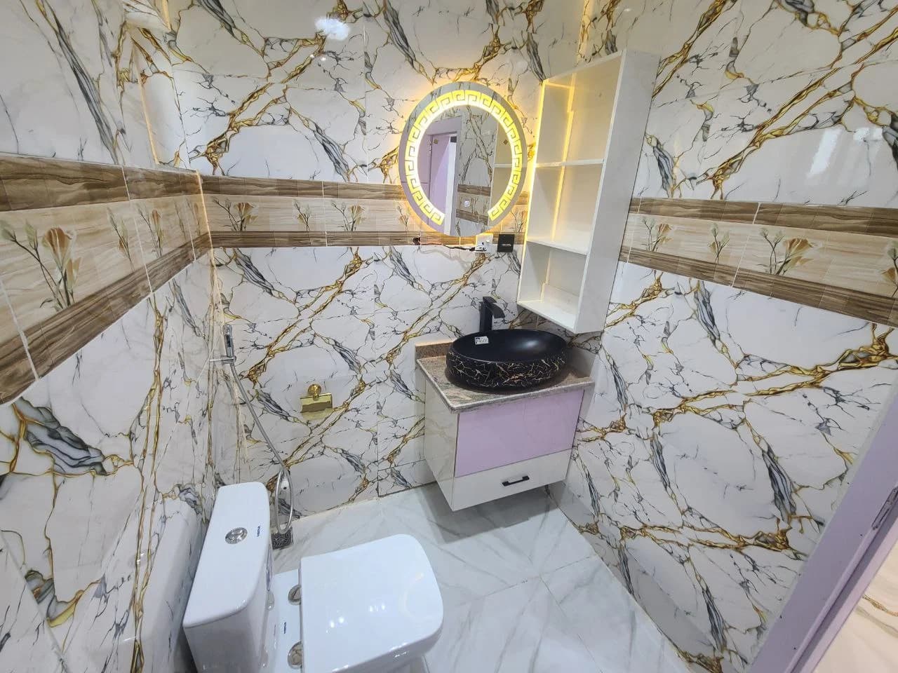 Luxury washroom with illuminated mirror